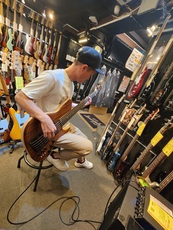 Singaporean buying bass guitar in Ochanomizu Tokyo